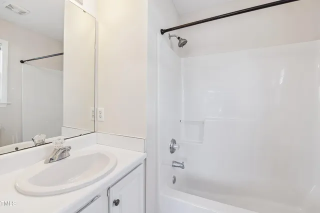 a bathroom with a sink and a bathtub