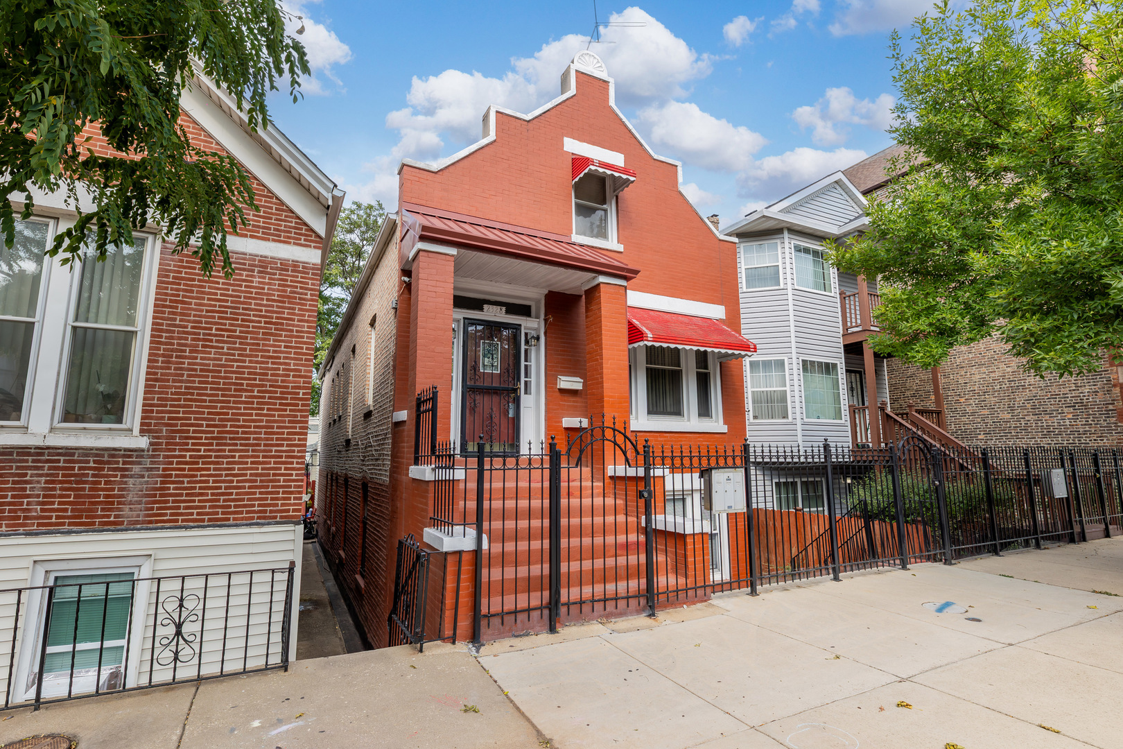 2328 West 19th Street Chicago, IL 60608 - Photo 2 of 31 a front view of a house with a garage