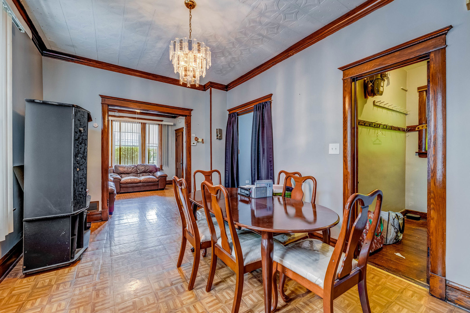 2328 West 19th Street Chicago, IL 60608 - Photo 22 of 31 a view of a dining room with furniture and a chandelier