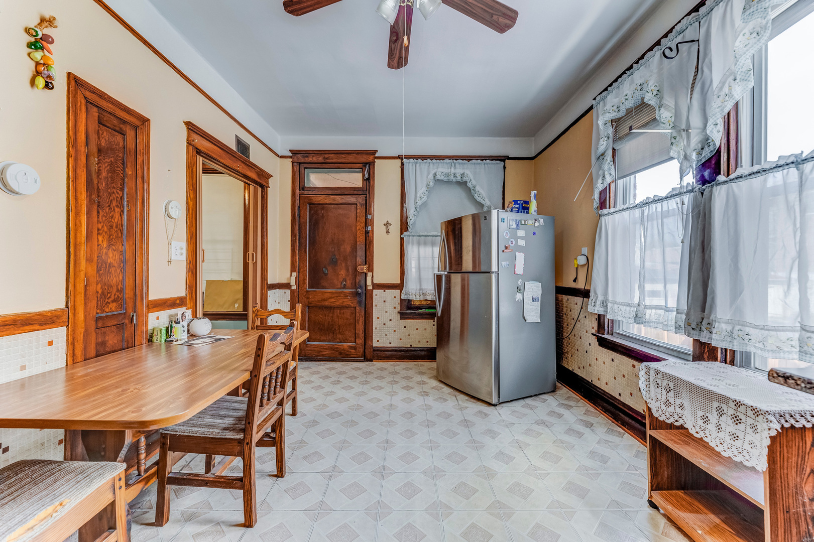 2328 West 19th Street Chicago, IL 60608 - Photo 24 of 31 a dining room with furniture and a window