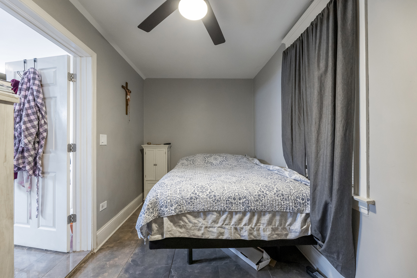 2328 West 19th Street Chicago, IL 60608 - Photo 10 of 31 a bedroom with a bed and a chandelier
