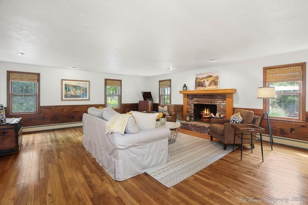 8 Curtis Road Boxford, MA 01921 - Photo 11 of 42 a living room with furniture and a fireplace