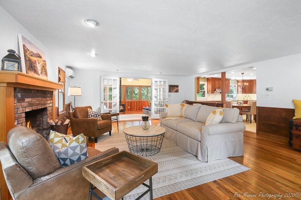 8 Curtis Road Boxford, MA 01921 - Photo 13 of 42 a living room with fireplace furniture and a wooden floor