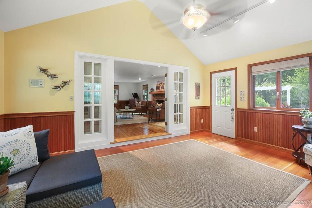 8 Curtis Road Boxford, MA 01921 - Photo 15 of 42 a living room with furniture and a open kitchen view