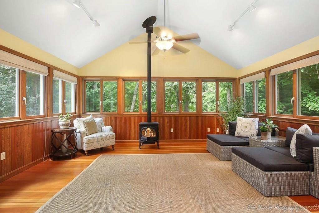 8 Curtis Road Boxford, MA 01921 - Photo 16 of 42 a living room with furniture and a large window