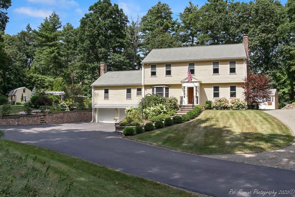 8 Curtis Road Boxford, MA 01921 - Photo 2 of 42 a front view of a house with a garden