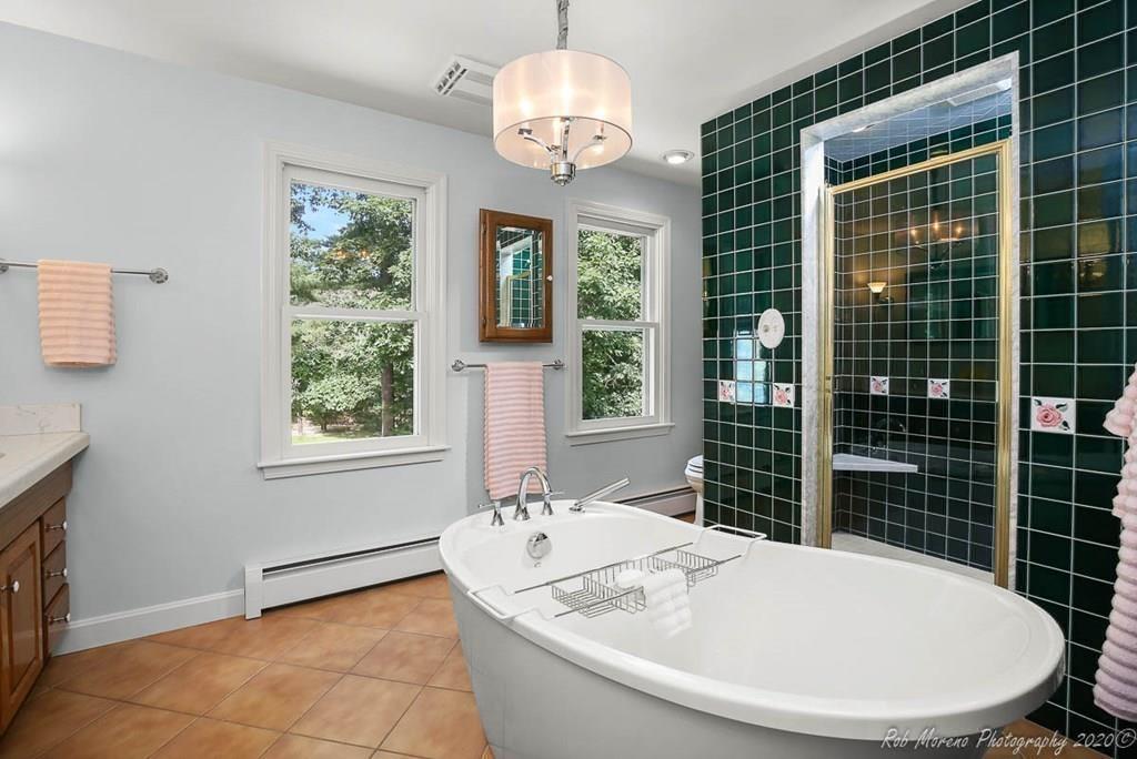 8 Curtis Road Boxford, MA 01921 - Photo 25 of 42 a bathroom with a tub sink and mirror
