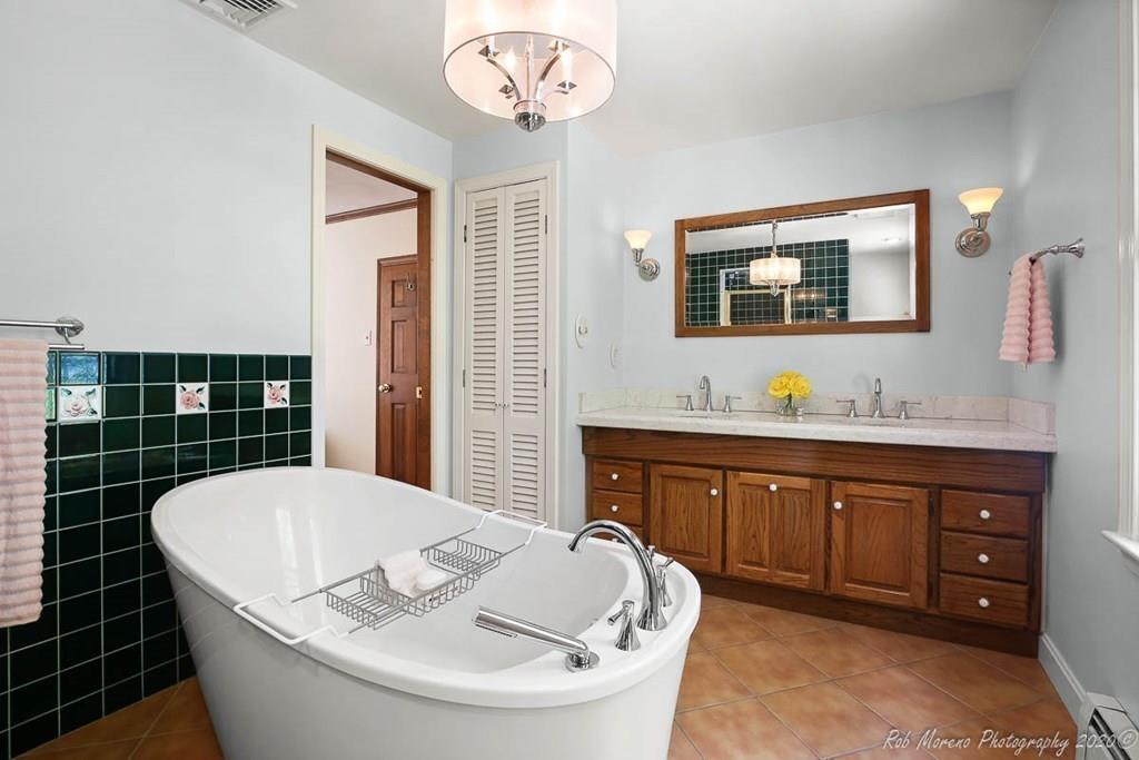 8 Curtis Road Boxford, MA 01921 - Photo 27 of 42 a bathroom with a tub sink and mirror