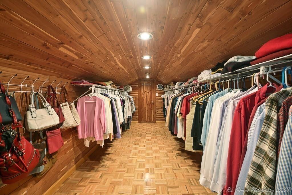 8 Curtis Road Boxford, MA 01921 - Photo 28 of 42 a view of walk in closet with clothes and shoes