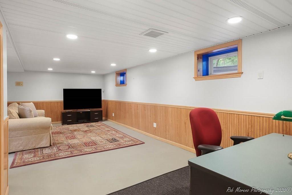 8 Curtis Road Boxford, MA 01921 - Photo 29 of 42 a living room with furniture and a flat screen tv