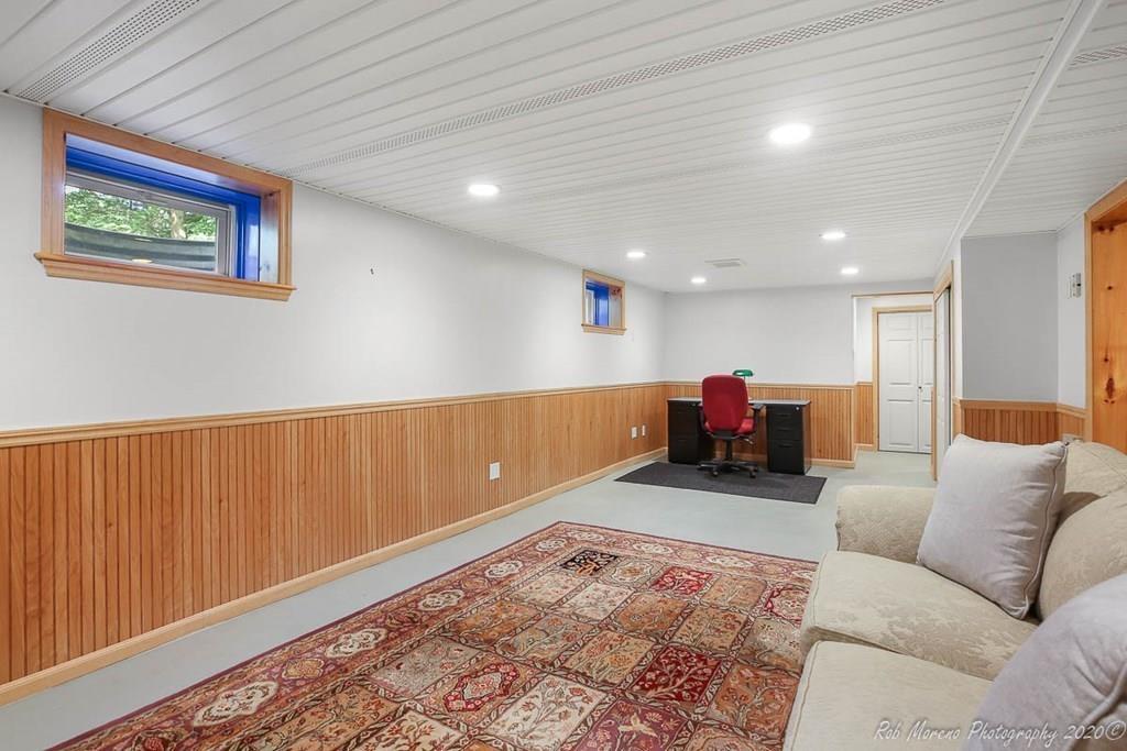 8 Curtis Road Boxford, MA 01921 - Photo 30 of 42 a living room with furniture and a flat screen tv