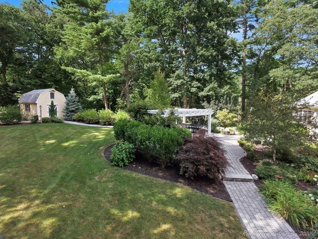 8 Curtis Road Boxford, MA 01921 - Photo 37 of 42 a view of a garden with a bench