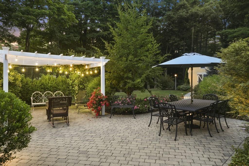 8 Curtis Road Boxford, MA 01921 - Photo 39 of 42 a view of a tables and chairs under an umbrella