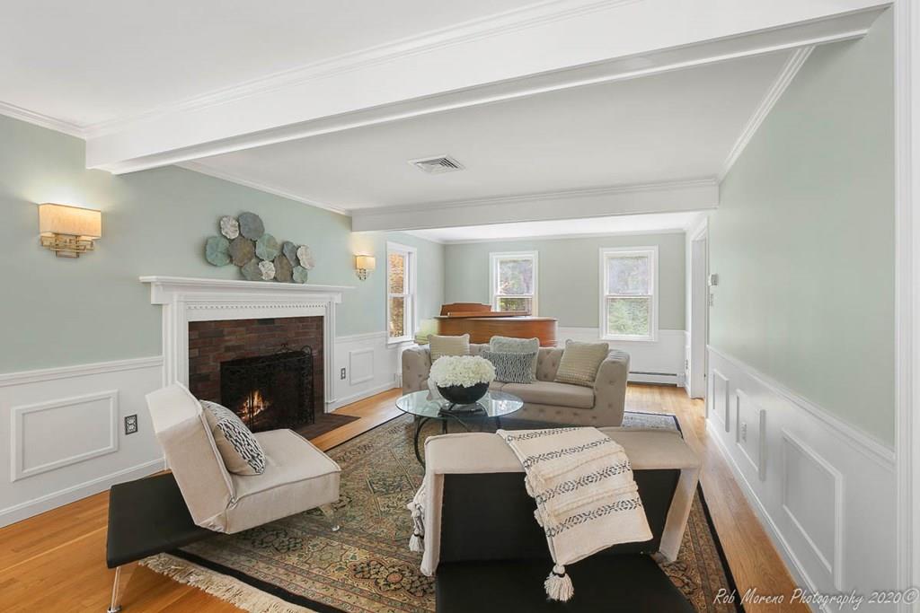 8 Curtis Road Boxford, MA 01921 - Photo 4 of 42 a living room with furniture and a fireplace