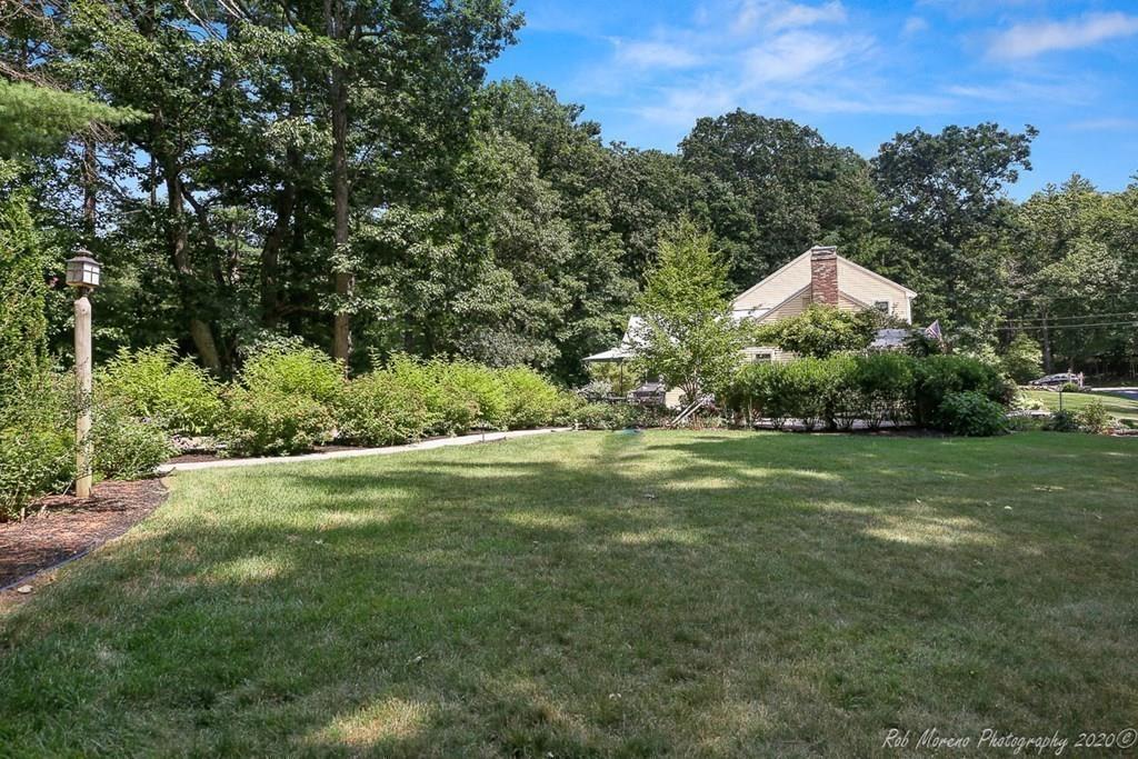 8 Curtis Road Boxford, MA 01921 - Photo 41 of 42 a front view of a house with a yard