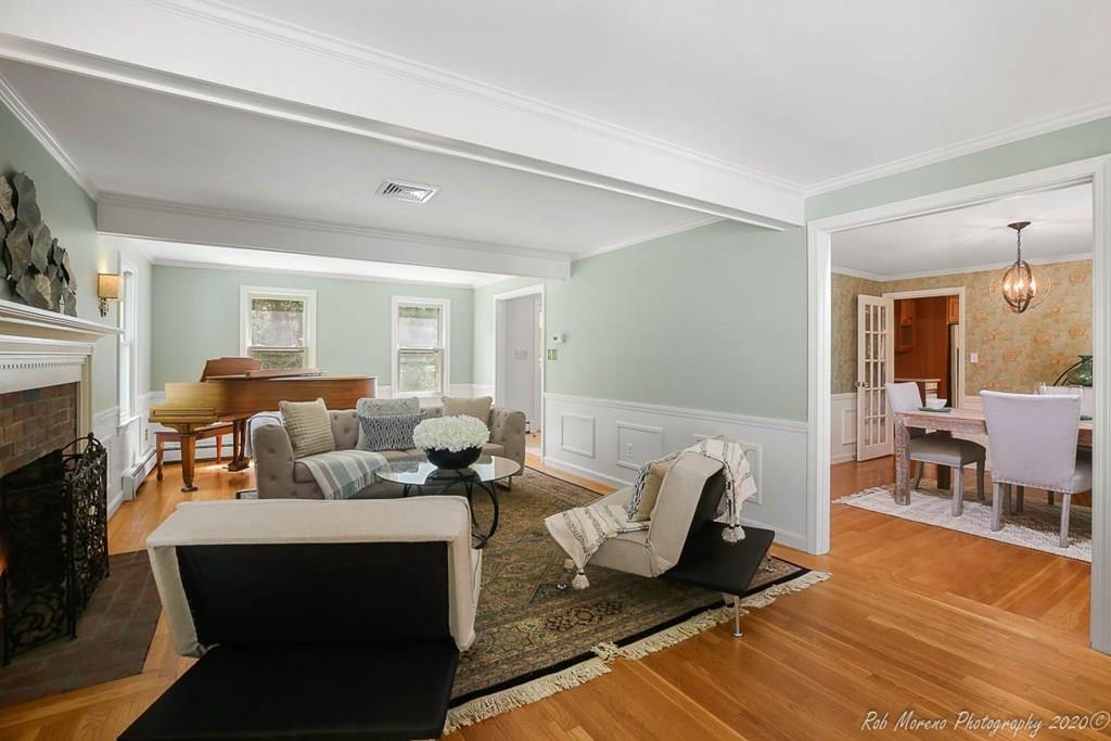 8 Curtis Road Boxford, MA 01921 - Photo 5 of 42 a living room with furniture a fireplace and a table