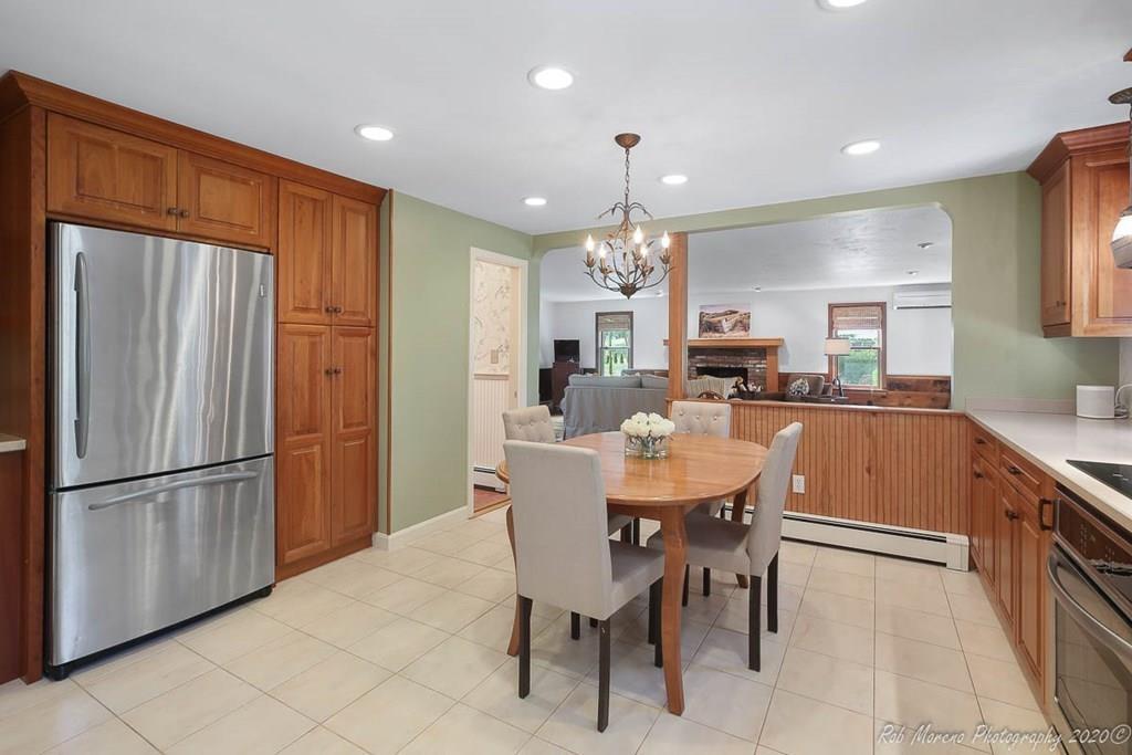 8 Curtis Road Boxford, MA 01921 - Photo 8 of 42 a large kitchen with a table and chairs