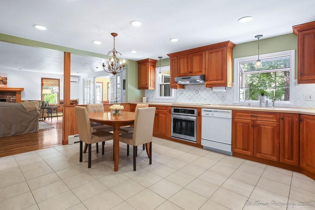 8 Curtis Road Boxford, MA 01921 - Photo 9 of 42 a large kitchen with a table and chairs