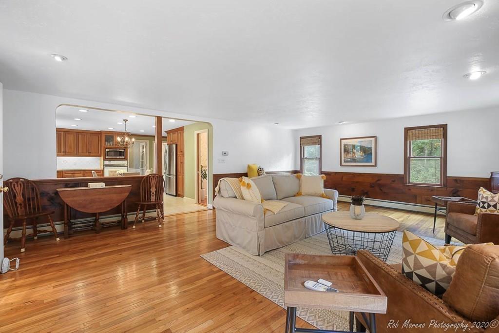 8 Curtis Road Boxford, MA 01921 - Photo 10 of 42 a living room with furniture wooden floor and a table