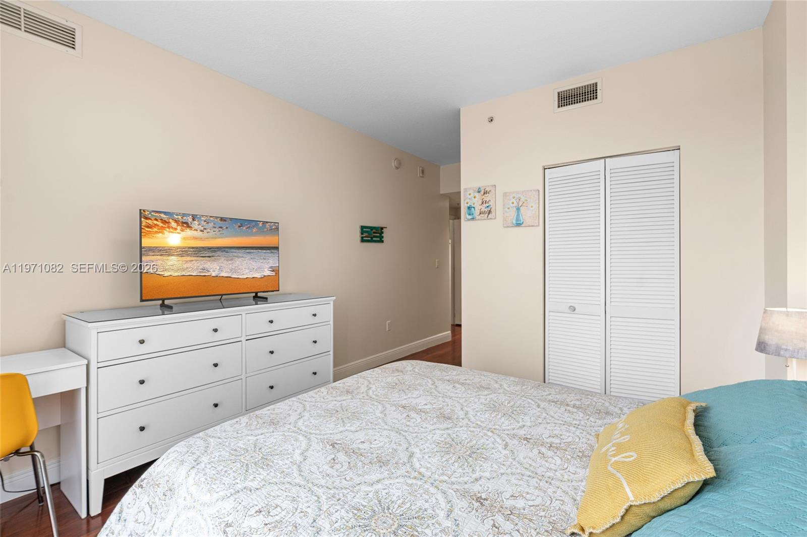 7275 Southwest 90th Way, Unit 404 Miami, FL 33156 - Photo 19 of 35 a bed room with a bed and a television