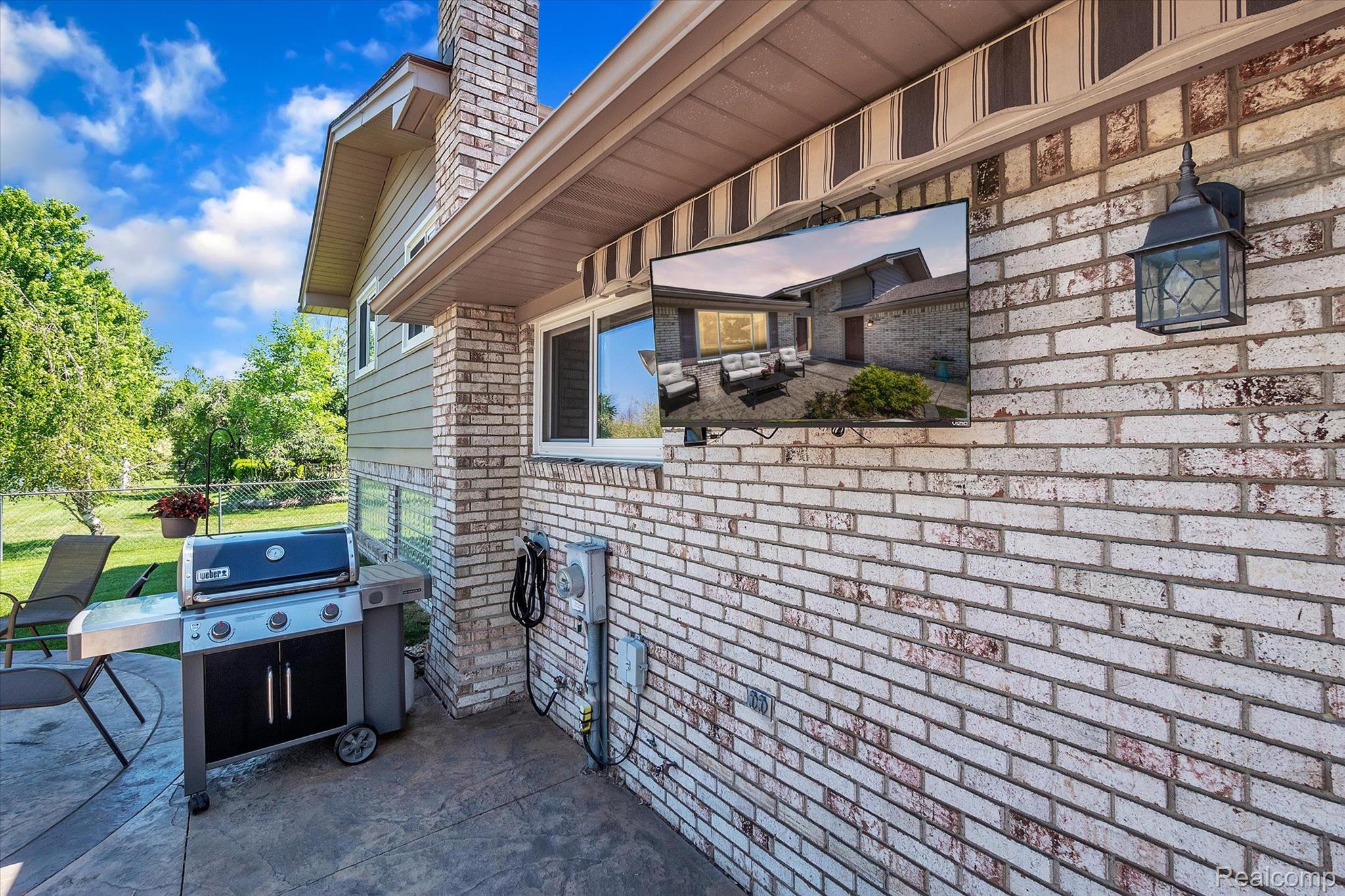 47882 Tilch Road Macomb, MI 48044 - Photo 39 of 47 The TV outside adds the final touch to paradise
