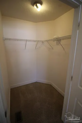 a view of small space with racks on the wall