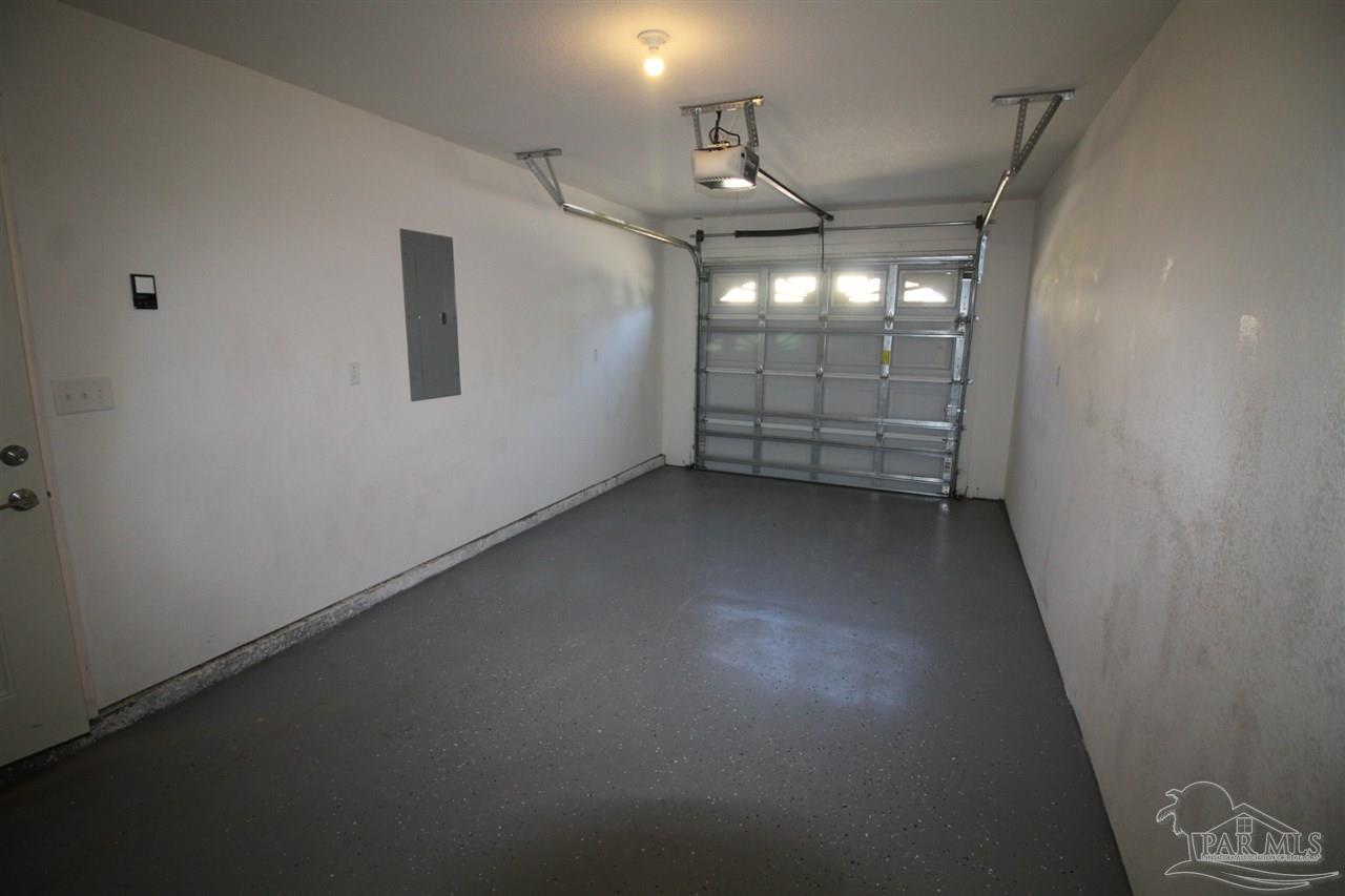 6250 Hamilton Bridge Road, Unit B Milton, FL 32570 - Photo 16 of 16 an empty room with windows and ceiling fan