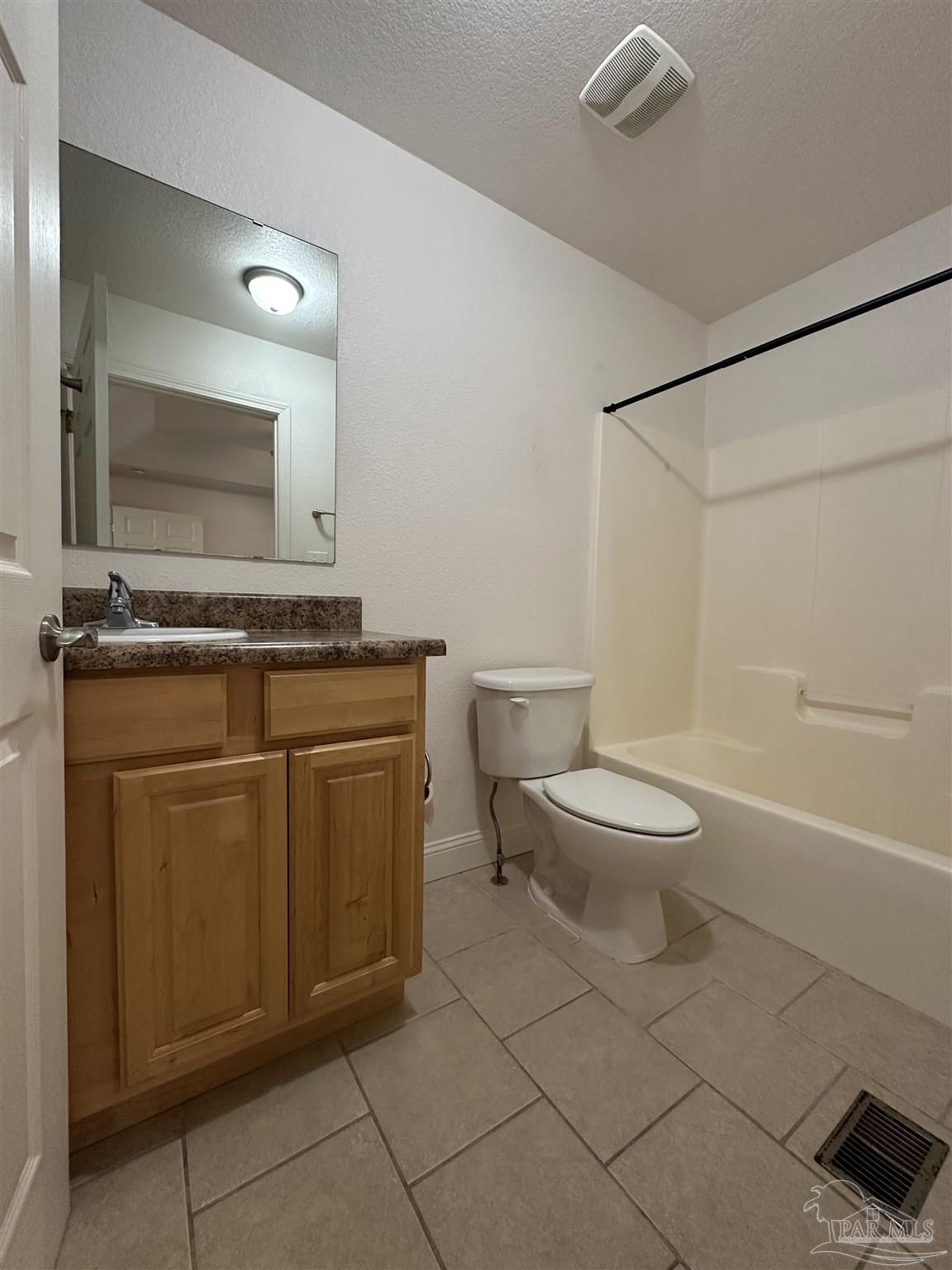6250 Hamilton Bridge Road, Unit B Milton, FL 32570 - Photo 8 of 16 a bathroom with a toilet sink and mirror