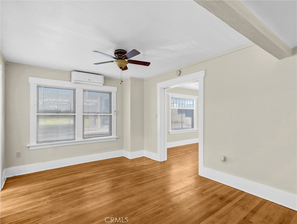 73 South Michigan Avenue Pasadena, CA 91106 - Photo 11 of 17 a view of an empty room with a window and wooden floor