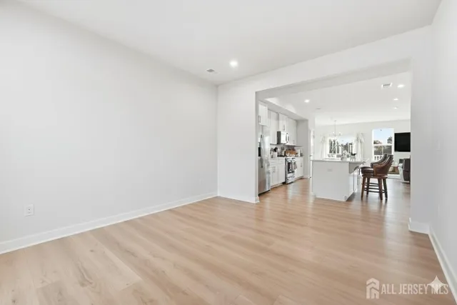 a view of a livingroom with furniture nad wooden floor