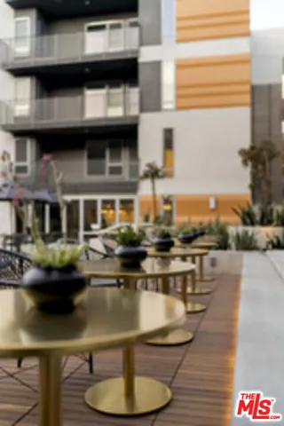 a outdoor space with patio fireplace and a potted plant