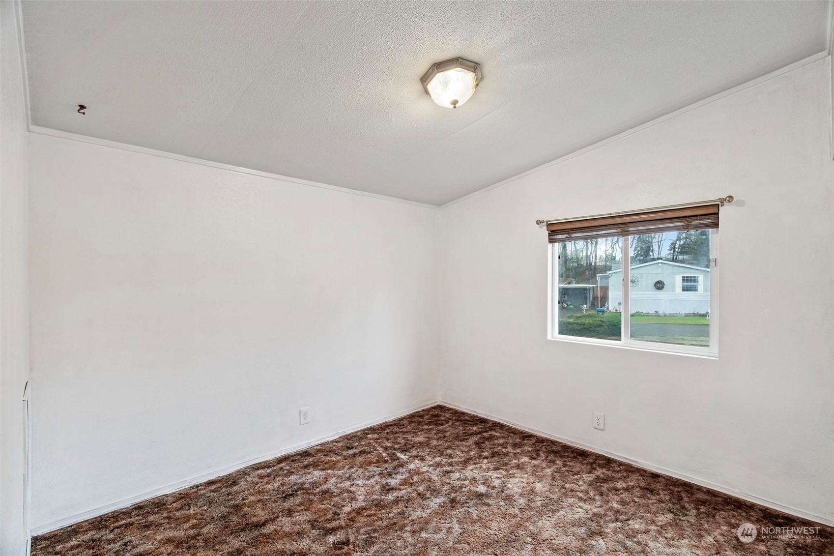 10239 185th Avenue Southwest, Unit 54 Rochester, WA 98579 - Photo 13 of 24 an empty room with a window