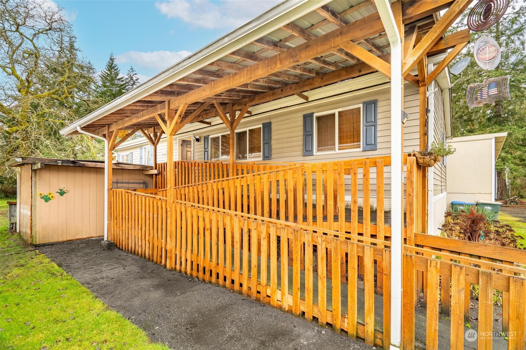 10239 185th Avenue Southwest, Unit 54 Rochester, WA 98579 - Photo 3 of 24 a view of a house with a small yard