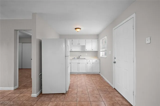 a kitchen with a refrigerator a sink and dishwasher