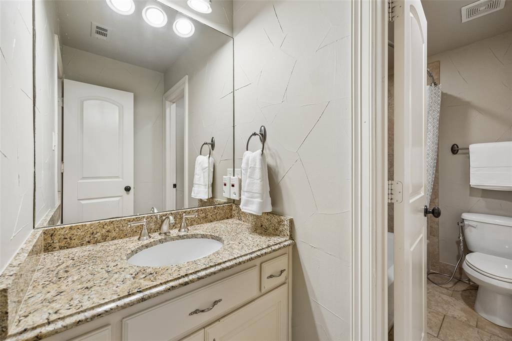 1608 Tuscan Ridge Circle Southlake, TX 76092 - Photo 23 of 36 a bathroom with a granite countertop sink and a mirror