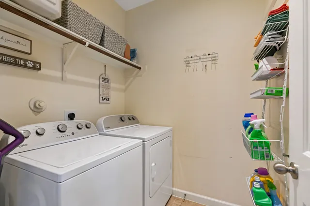 a bathroom with a sink a toilet a mirror and shower curtain