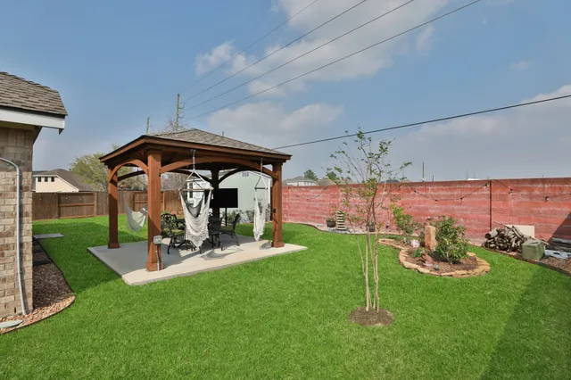 a patio with a yard table and chairs