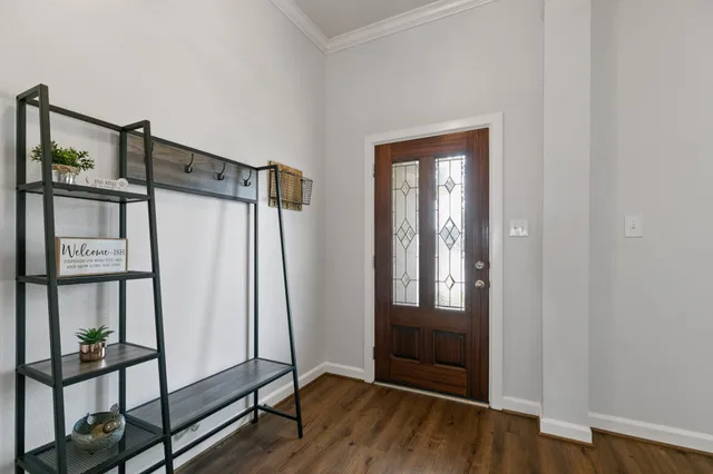 a view of front door with wooden floor