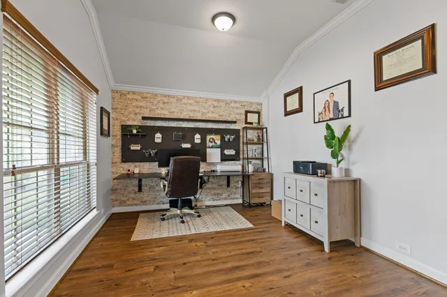 a view of a workspace with furniture and lounge chair