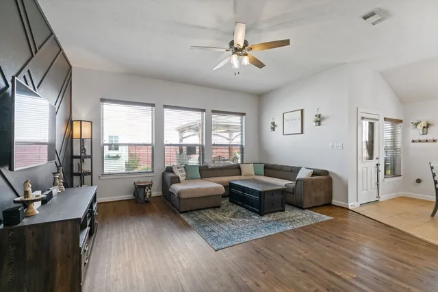 a living room with furniture and a large window