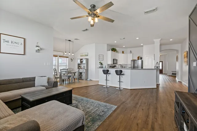 a view of a house with a backyard