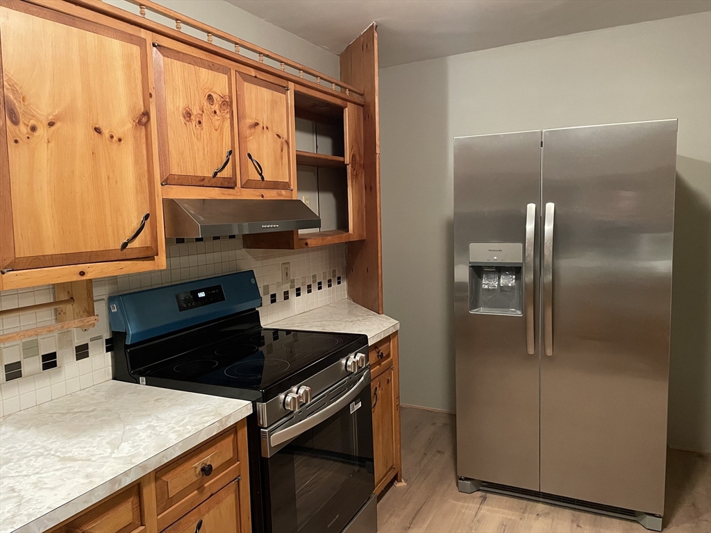 719 Mt Hermon Station Road Northfield, MA 01360 - Photo 12 of 41 a kitchen with stainless steel appliances granite countertop a refrigerator and a stove