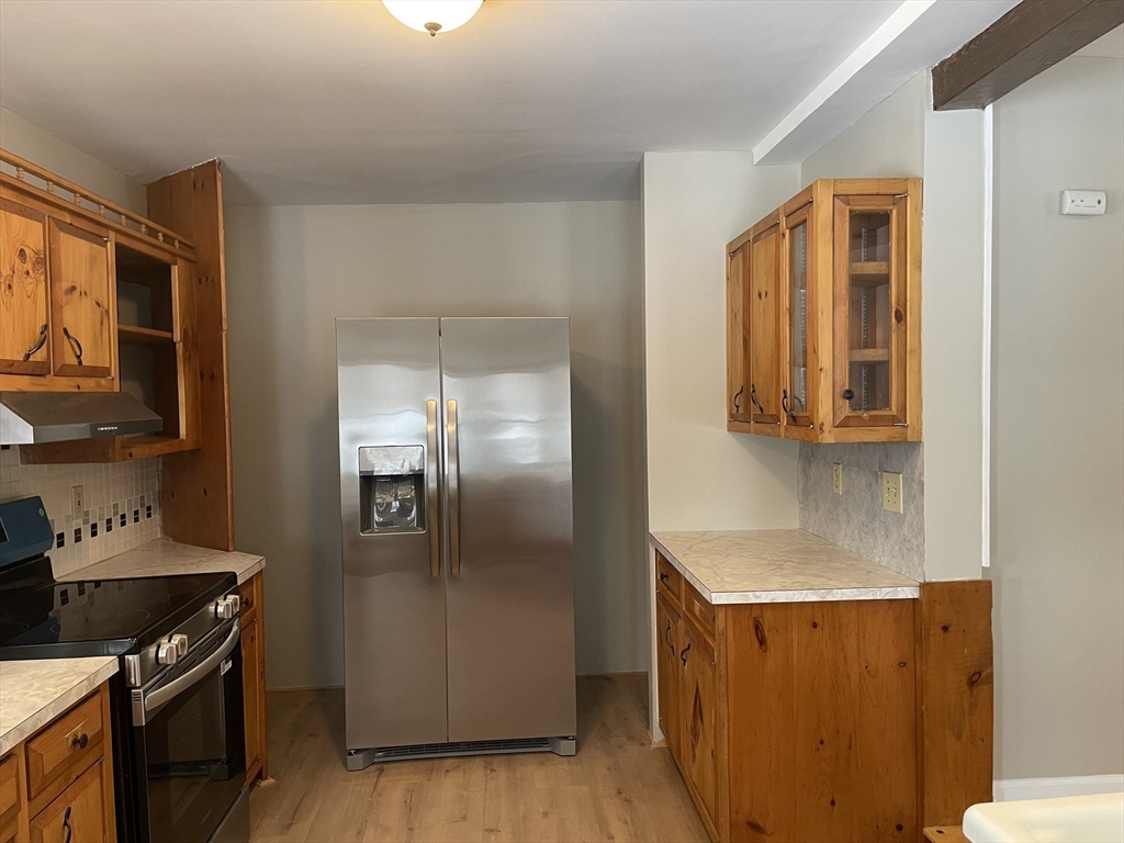 719 Mt Hermon Station Road Northfield, MA 01360 - Photo 13 of 41 a kitchen with stainless steel appliances granite countertop a refrigerator and a stove