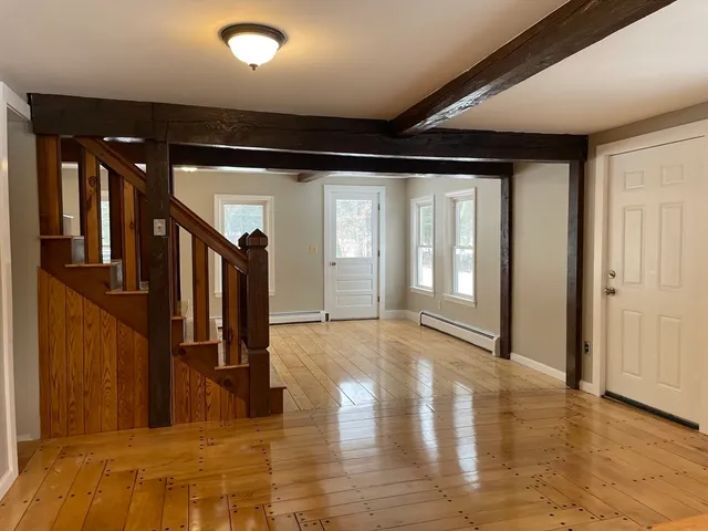 an empty room with a empty space and a window