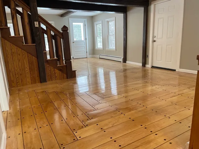 a view of a house with a yard and deck