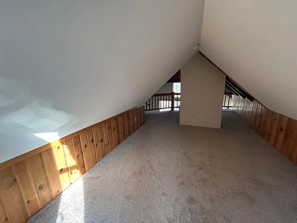 an empty room with a empty space and a window