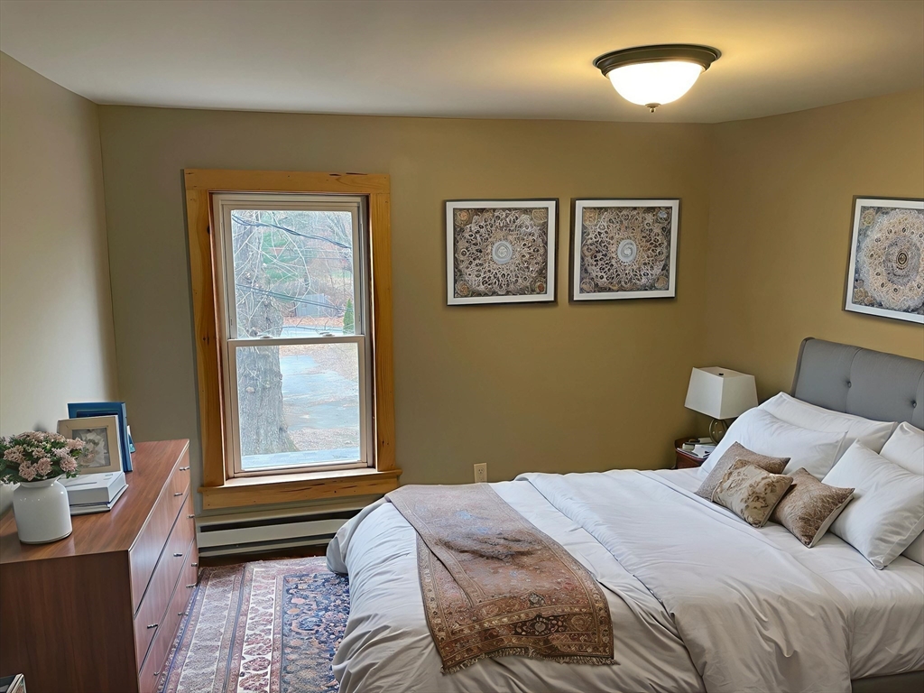 719 Mt Hermon Station Road Northfield, MA 01360 - Photo 31 of 41 a bedroom with a bed and a window