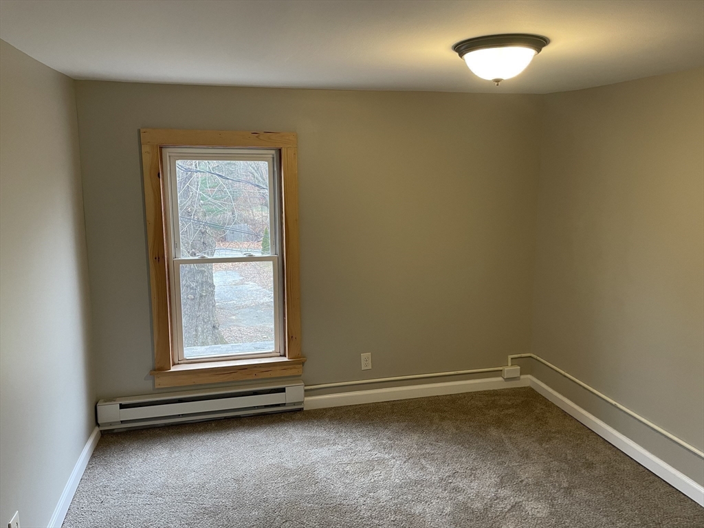 719 Mt Hermon Station Road Northfield, MA 01360 - Photo 32 of 41 an empty room with a empty space and a window