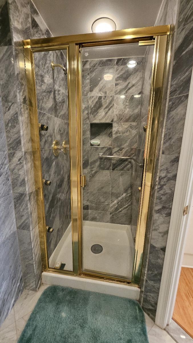 3801 Canterbury Road, Unit 409 Baltimore, MD 21218 - Photo 12 of 31 Primary Bathroom Shower