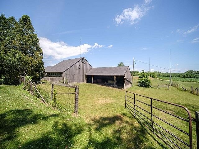 4909 West Edgewood Road Dixon, IL 61021 - Photo 39 of 96 a view of a swimming pool with a chair
